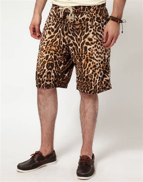 Unleash your wild side with men's leopard print shorts