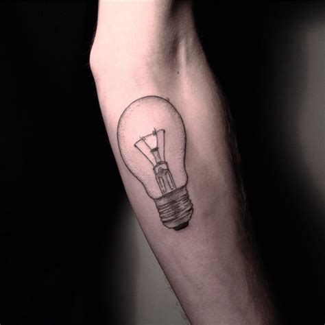 Light bulb tattoo on the left inner arm. Minimalist