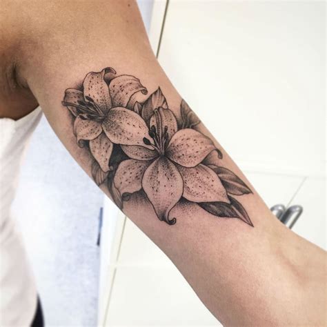 Teeny tiny lily tattoo on the wrist. Lily tattoo