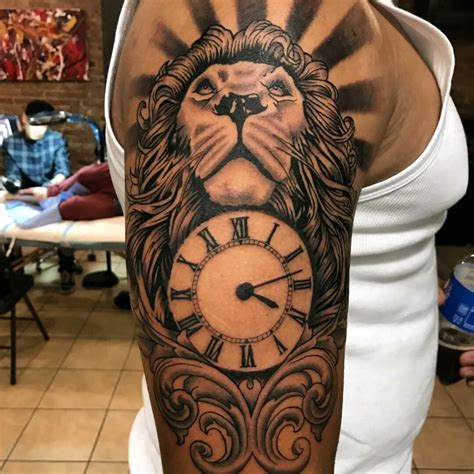 Lion With A Clock Tattoo