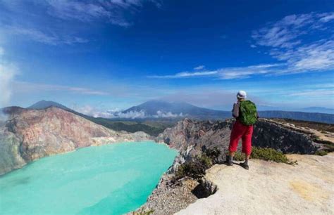 Local Guide Assisting Hiker Ijen