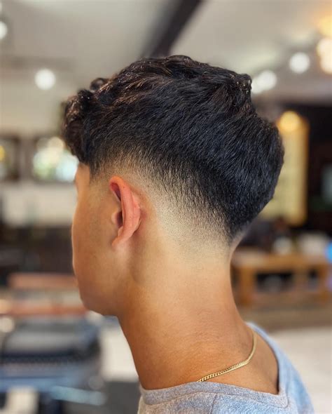Enhance Your Confidence with the Sleek and Distinguished Low Skin Taper Fade Style