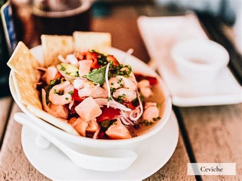 Hands preparing ceviche in a cooking class