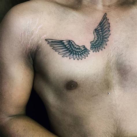 Male Simple Chest Piece Tattoos