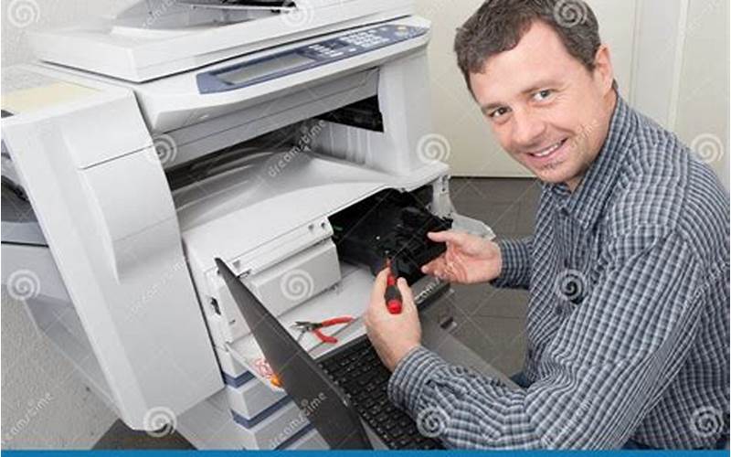 Man Repairing Printer