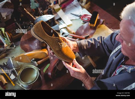 Man examining shoe damage