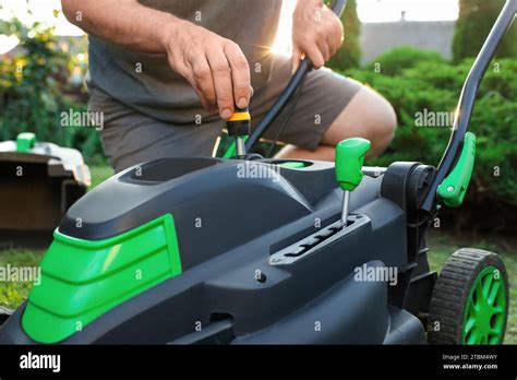 Man fixing a lawn mower