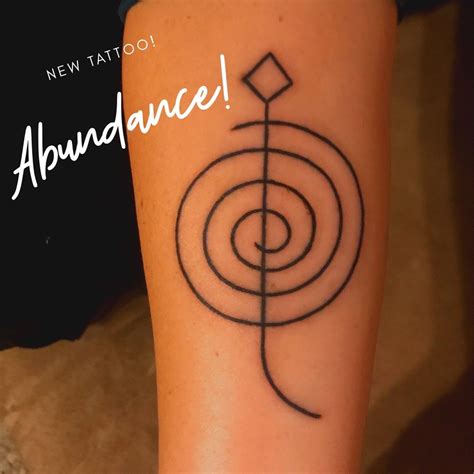 Manifest Symbol Tattoo