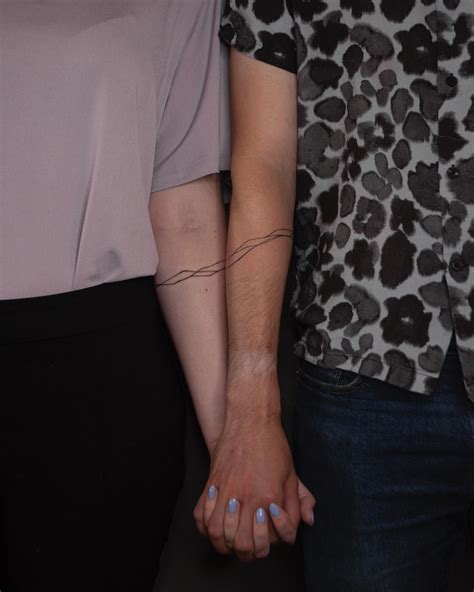 Matching Forearm Tattoos: Ink-Bound Connections