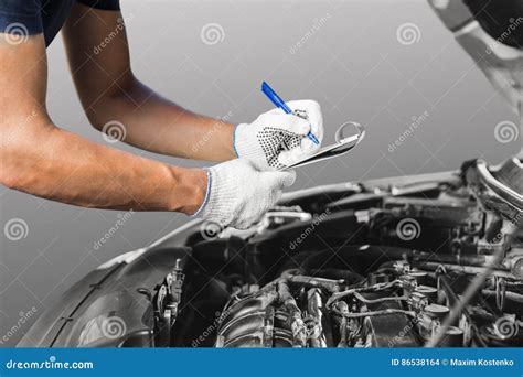 Mechanic Checking Car Engine