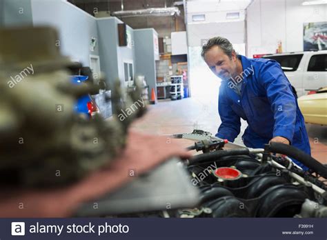 Mechanic Examining Chrysler Engine