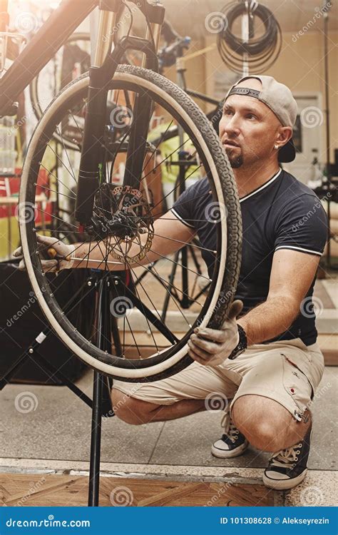 Mechanic Repairing Bicycle