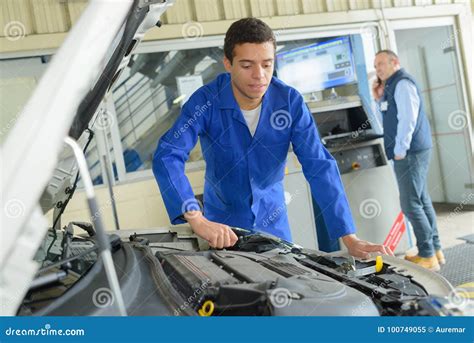 Mechanic checking car engine Lexington KY
