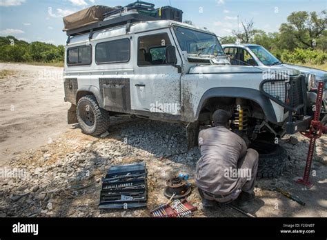 Mechanic working on Land Rover