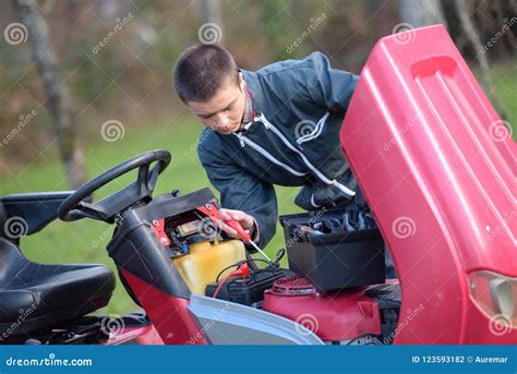 Mechanic working on lawn mower