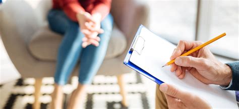 Mental health evaluator administering a psychological test