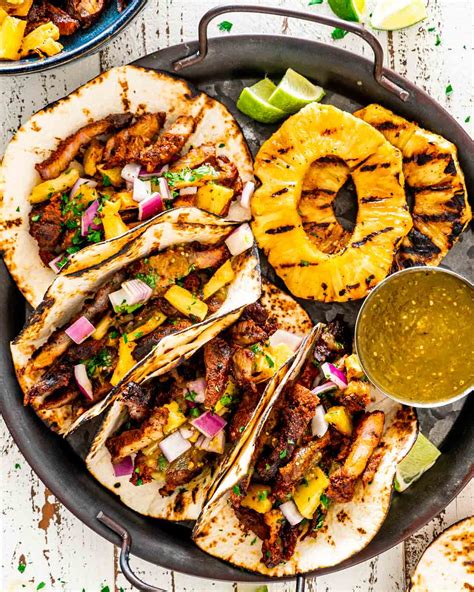 Mexican Street Food Tacos Al Pastor: Trying The Spit-Roasted Pork Tacos With Pineapple And Cilantro