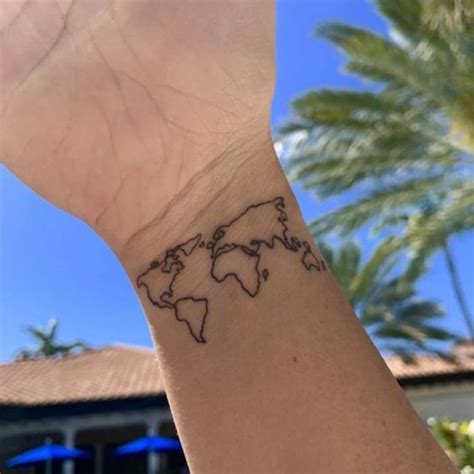 Minimalist world map tattoo on the wrist