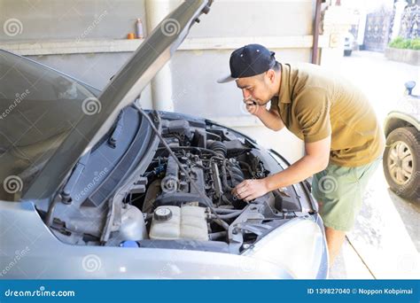 Mobile Mechanic Checking Car Engine