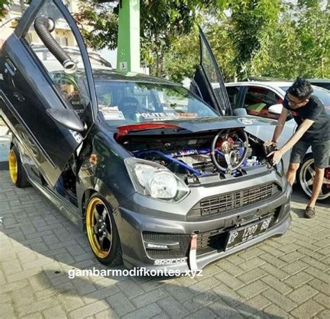 Modifikasi Mobil Ayla Hitam