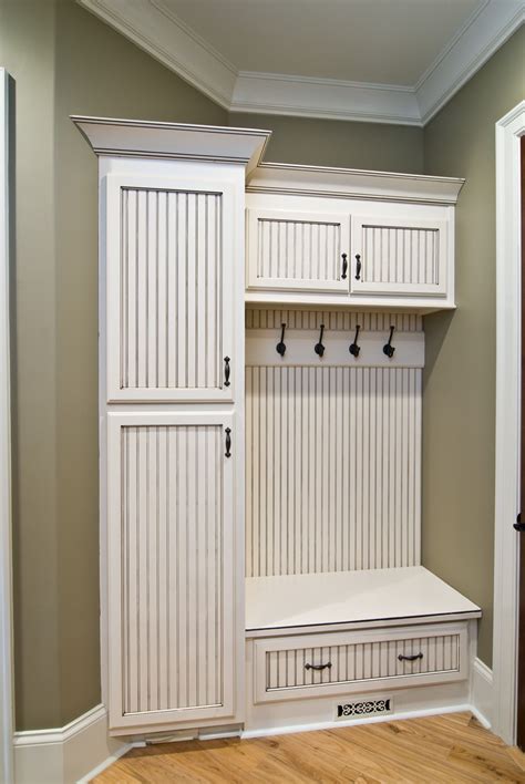 Traditional Mudroom With Blue Cubby Storage, Brick Floor and Upper and Lower Storage HGTV