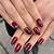 Mysterious and Mesmerizing: Dark Red Nail Art for a Captivating Look