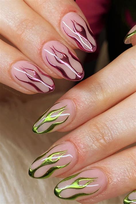 Oil slick chrome holographic stiletto nails (With images) Chrome nail
