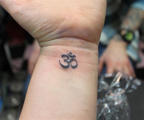 Namaste Tattoo on upper left shoulder with om sign