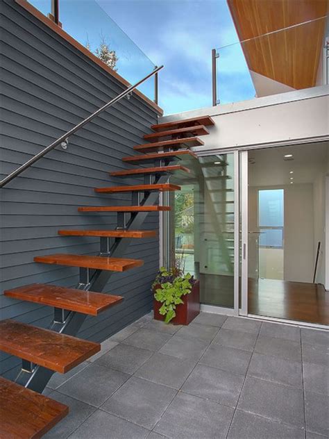 Mounted on side of steps for narrow stair cases. Outdoor handrail