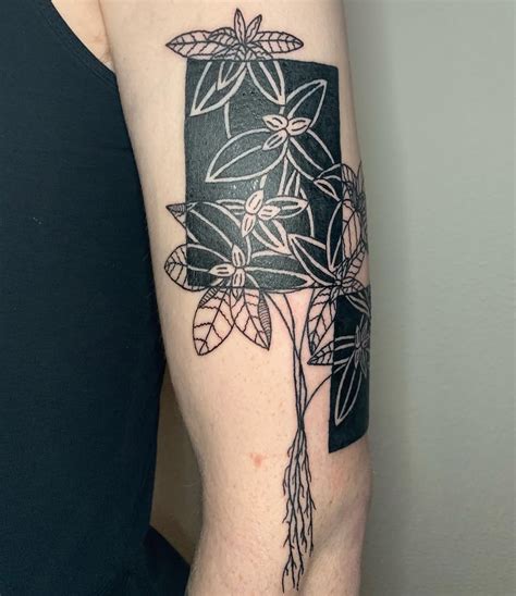 Negative Space Masterpieces Arm Tattoos that Play with Absence