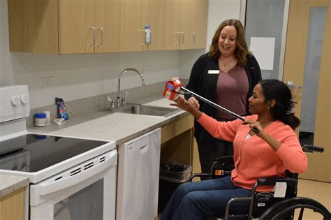Occupational Therapy Assistant Helping Patient