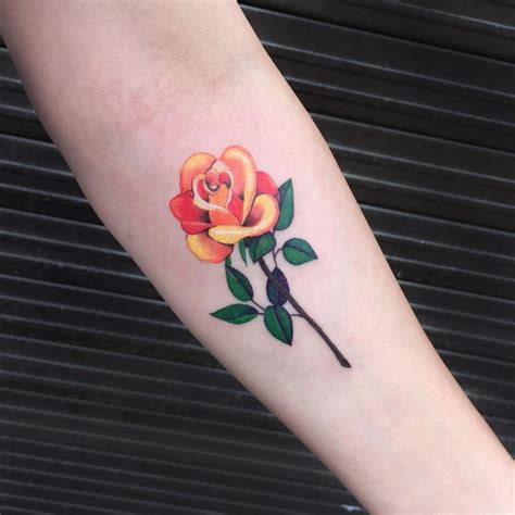 Orange rose by Logan shermeyer at folk city tattoo, va