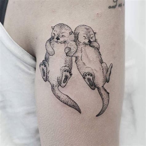 Otters Holding Hands Tattoo