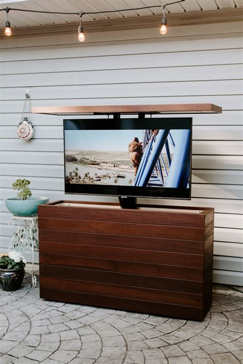 Downright Simple Outdoor TV for 50" TV. Box Frame is made from pressure treated 2x8
