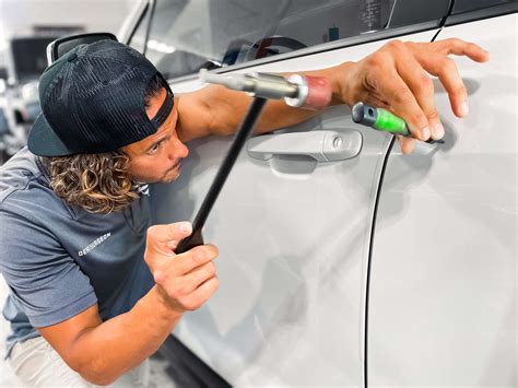 Paintless Dent Repair Technician at Work
