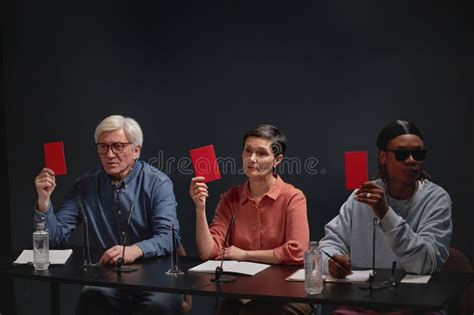 Panel of Judges Evaluating Poster Submissions