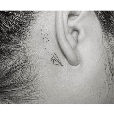 Paper Airplane Tattoo Behind Ear