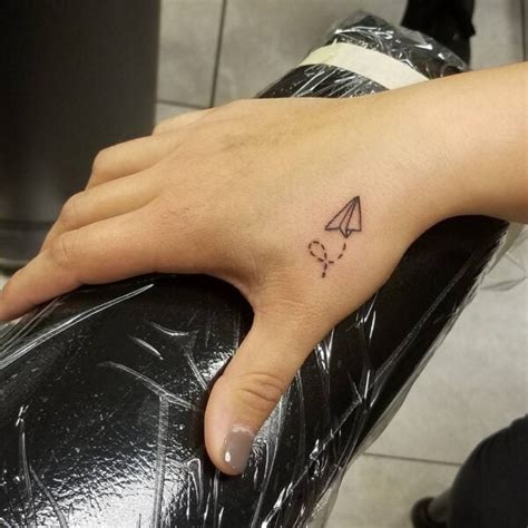 Paper Airplane Tattoo Finger