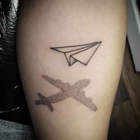 Paper airplane tattoo, with B787 shadow Paper airplane