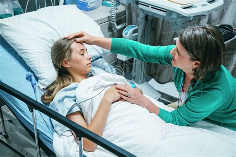 Patient in Hospital Bed with Doctor