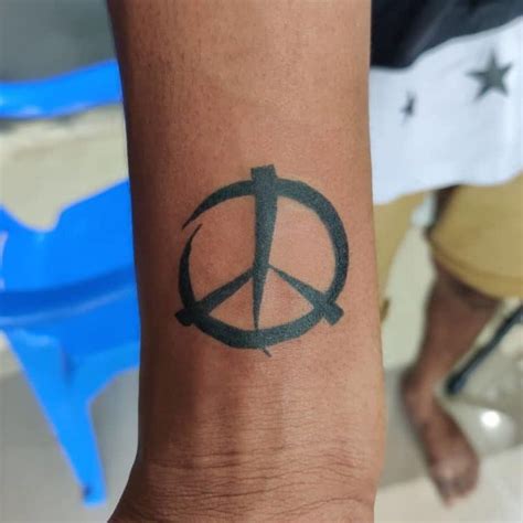 Peace tattoo/ left wrist Mom's going to freak... Pinterest