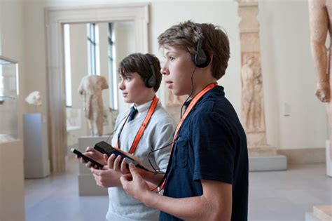 People using audio guide museum