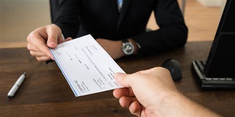 Image of a person receiving a check