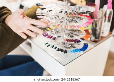 Persons Hand Selecting Variety Nail