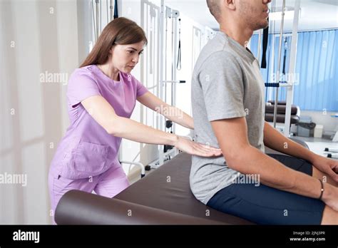 Physical Therapy Examining a Patient
