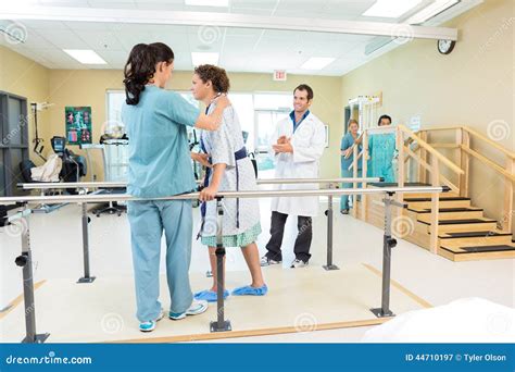 Physical Therapy Tech Assisting a Patient