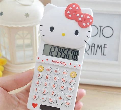 Calculate in Style with the Pink Hello Kitty Calculator - The Perfect Addition to Your Desk!