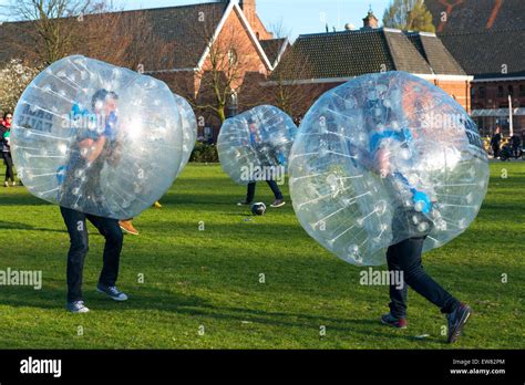 Players inside big plastic bubbles