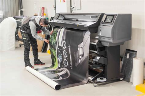 Plotter Repair New York - Technician inspecting a plotter