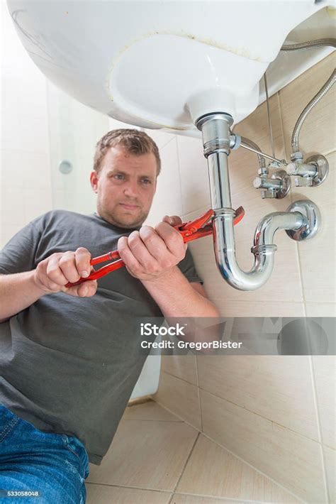 Plumber Repairing Drain